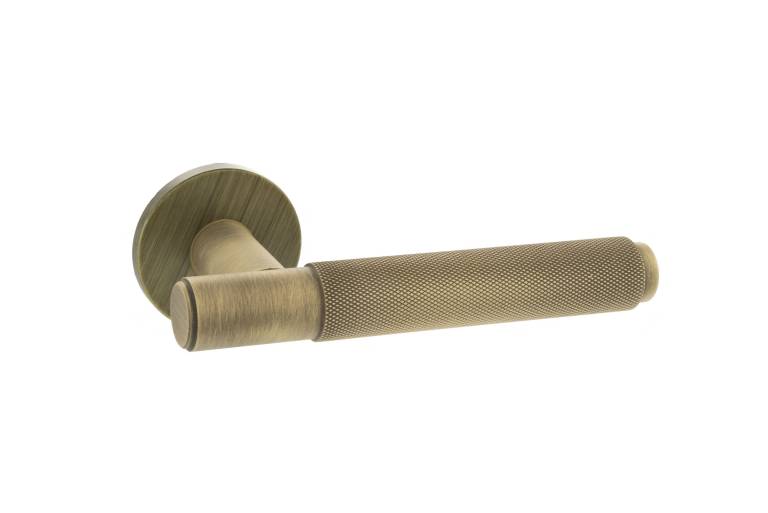 MHSR100YB Millhouse Brass Crompton Knurled Lever Door Handle on 5mm Slimline Round Rose - Yester Bronze