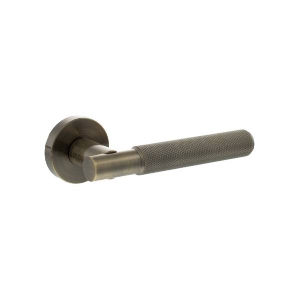 SPR170AB Senza Pari Rosarno Knurled Lever Door Handle on Minimal Round Rose - Antique Brass